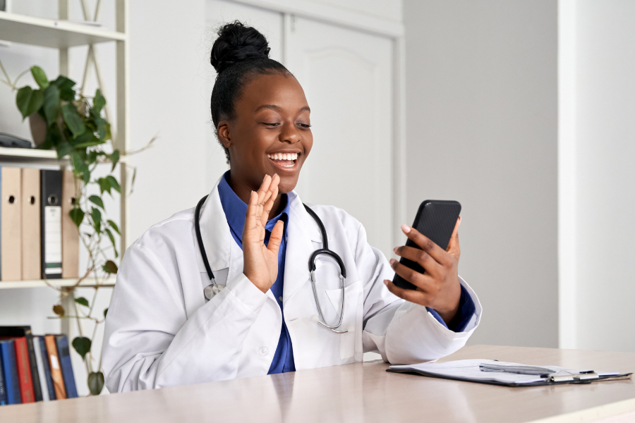 A medical provider users TikTok on her mobile phone to promote her practice