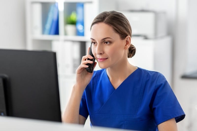 Medical professional taking patient testimonial over the phone